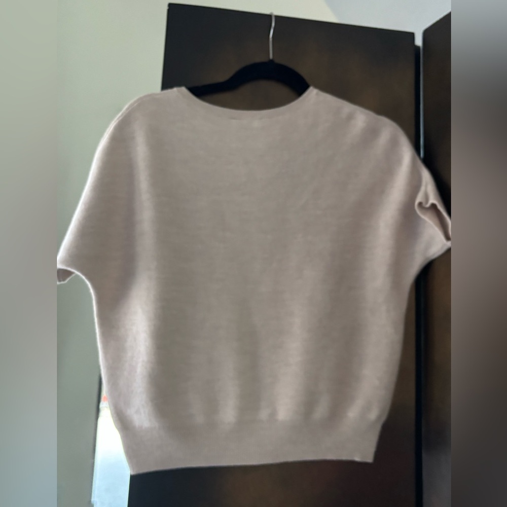 The Reset light beige knit top.